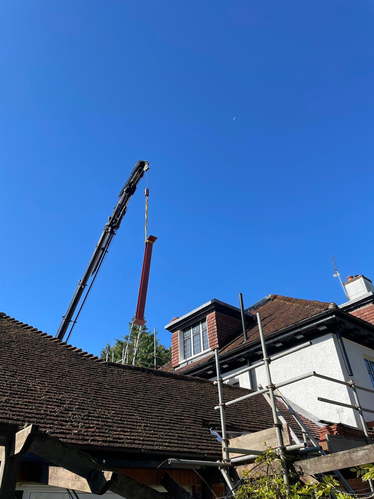 Crane lift, roof works, an I.C Developments project in Surrey